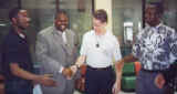 Paxworks artist John Ridder is welcomed by dignitaries at the S.U.N.O. labyrinth dedication